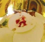 Eucharistic miracle — host with red stains in chalice.