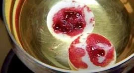 Eucharistic miracle showing consecrated host with red stains, symbol of Christ’s blood