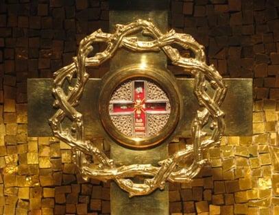 Precious Relic of the True Cross displayed in an ornate Catholic reliquary for veneration.